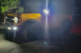 Yellow Ford Bronco in a driveway with LED Off-Road Side Mirrors turned on.
