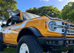 Low angle of an orange Ford Bronco with LED Off-Road Side Mirrors installed.