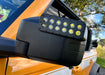 Extreme close-up of LED Off-Road Side Mirrors installed on an orange Ford Bronco.