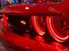 Close-up of challenger headlights with red halos