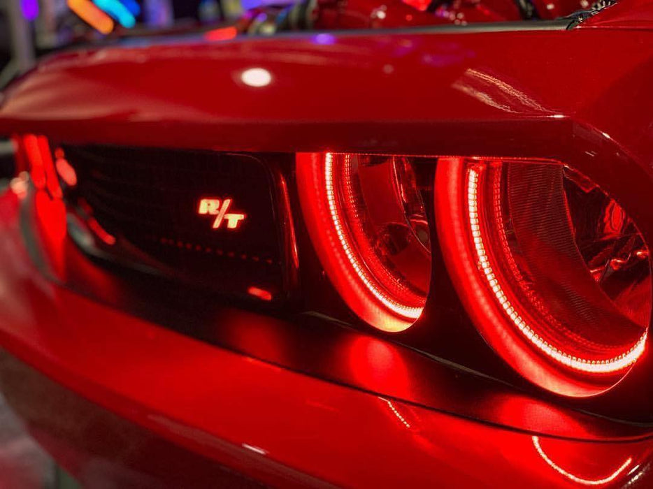 Close-up of challenger headlights with red halos