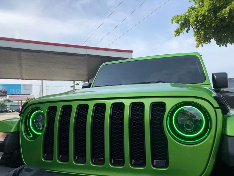 Close-up of green jeep with green halo headlights