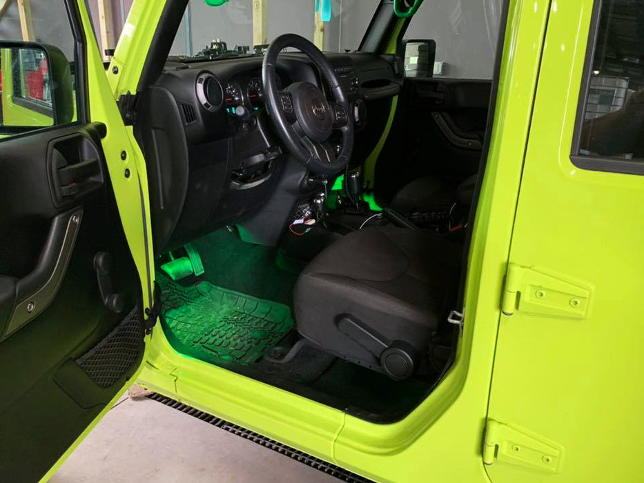 Jeep front door open with green footwell lighting