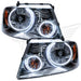 Ford F-150 headlights with white LED halo rings.