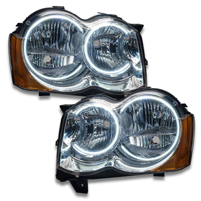 Jeep Grand Cherokee headlights with white LED halo rings.
