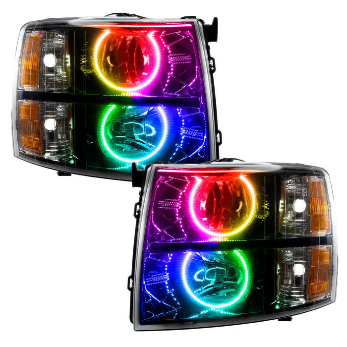 Chevrolet Silverado headlights with black housing and ColorSHIFT LED halo rings.