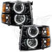 Chevrolet Silverado headlights with black housing and white LED halo rings.