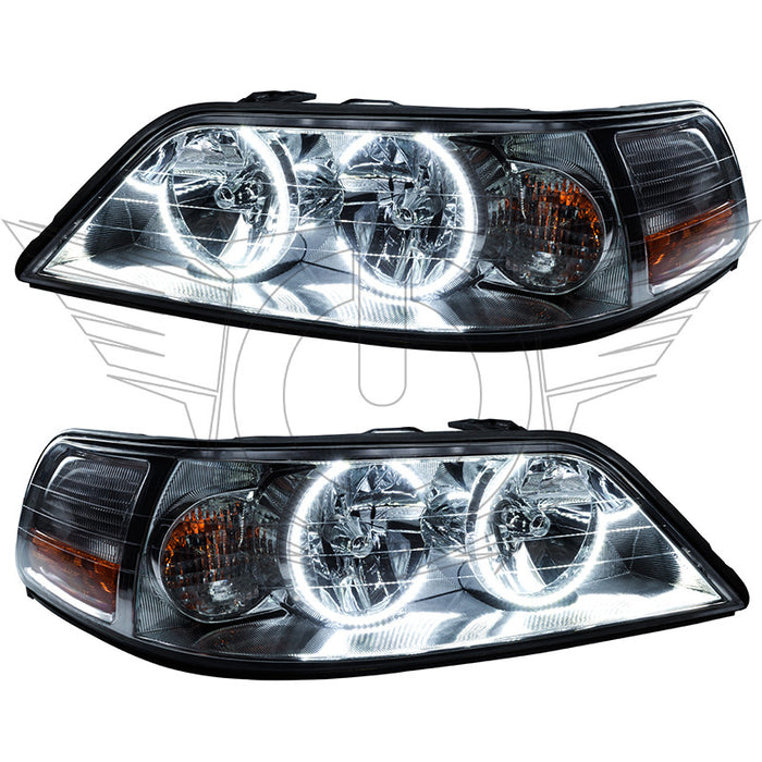 Lincoln Town Car headlights with white LED halo rings.