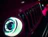 Close-up on the grill of a Jeep with Oculus Headlights installed.