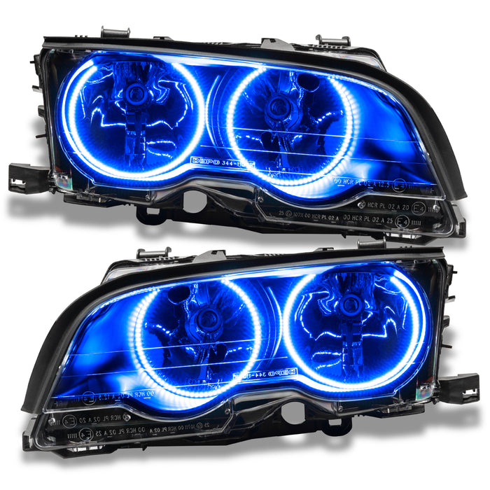 BMW 3 Series headlights with blue LED halo rings.