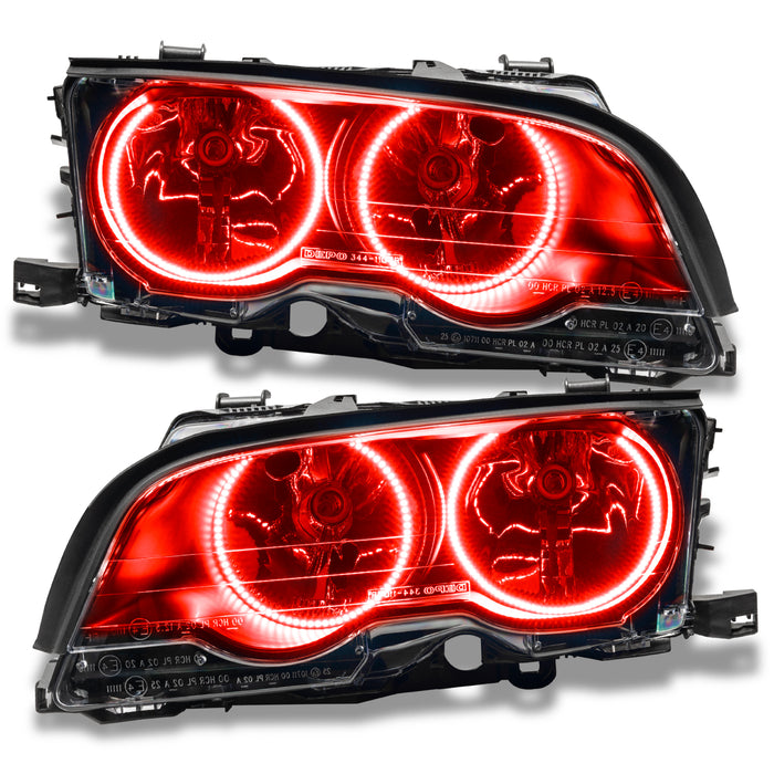 BMW 3 Series headlights with red LED halo rings.