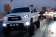 Toyota Tundra driving down a highway equipped with white LED headlight halo rings.
