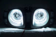 Nissan Xterra headlights with white LED halo rings.