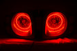 Nissan Xterra headlights with red LED halo rings.