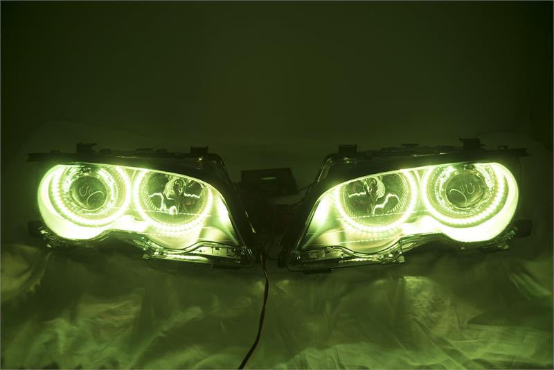 BMW 3 Series headlights with yellow LED halo rings.