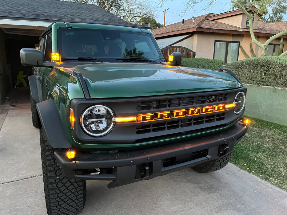 Green Ford Bronco with amber LED illuminated letter badges installed