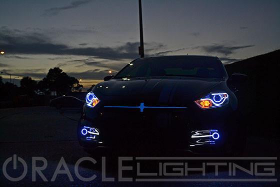 Front end of a Dodge Dart with LED headlight and fog light halos installed.