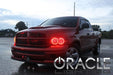 Three quarters view of a Dodge Ram with red LED headlight halo rings installed.