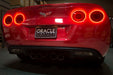 Rear view of C6 Corvette, with both sets of tail light halos glowing