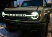 Close-up on the front end of a Ford Bronco with Universal Illuminated LED Letter Badges installed.