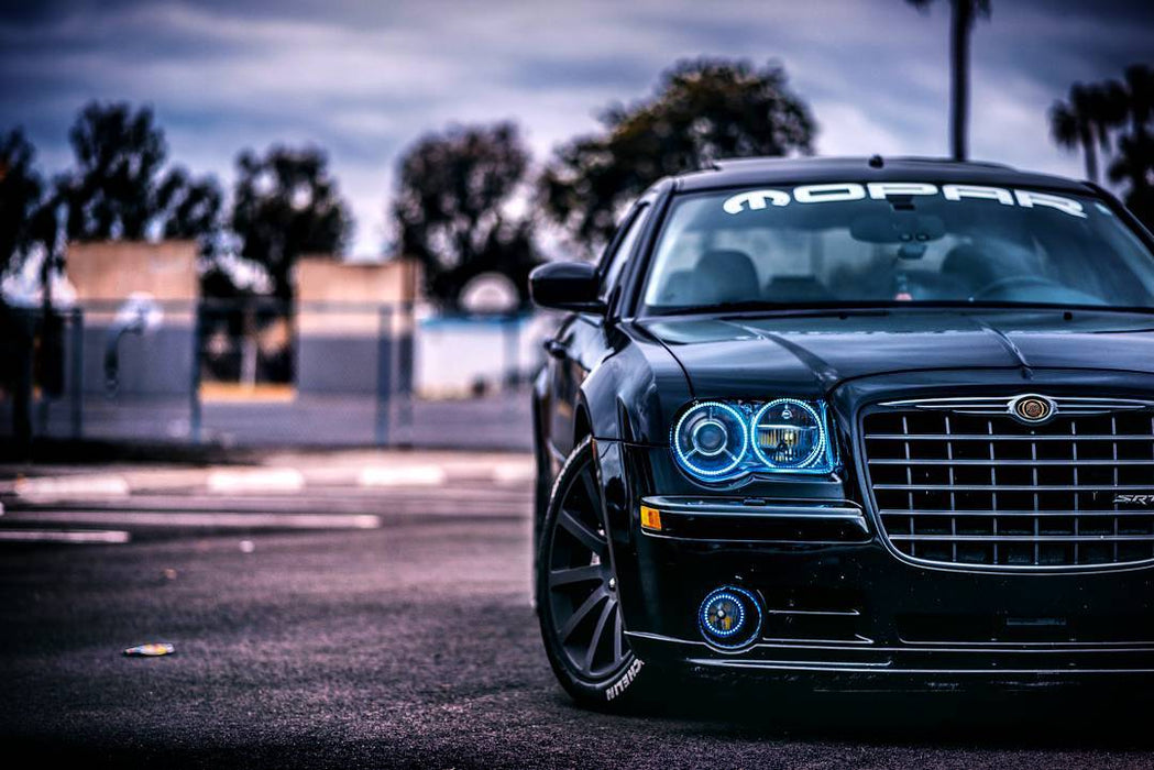 Front end of a Chrysler 300C with white LED headlight and fog light halo rings installed.