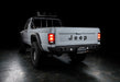 3 quarters rear view of Jeep Comanche with flush mount tail lights and brake lights on