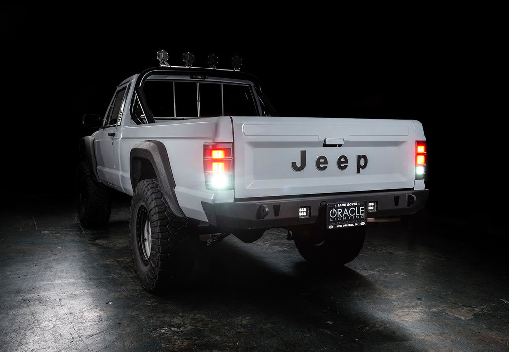 3 quarters rear view of Jeep Comanche with flush mount tail lights and reverse lights on