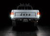 Rear view of Jeep Comanche with flush mount tail lights and reverse lights turned on