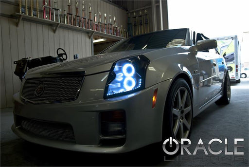 Three quarters view of a Cadillac CTS with white LED headlight halo rings.