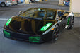 Three quarters view of a Lamborghini Gallardo with green LED headlight halo rings installed.