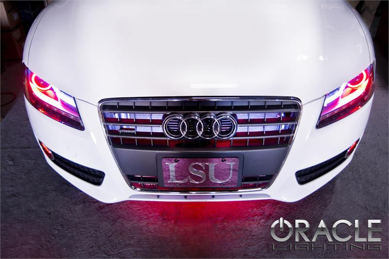 Front end of an Audi A5 with red LED headlight halo rings.