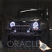Front end of a Jeep Wrangler with white LED headlight halo rings installed.