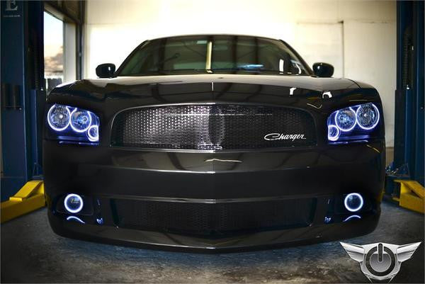 Front end of a black Dodge Charger with white LED headlight and fog light halo rings installed.