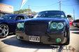 Front end of a Chrysler 300C with green LED headlight and fog light halo rings installed.