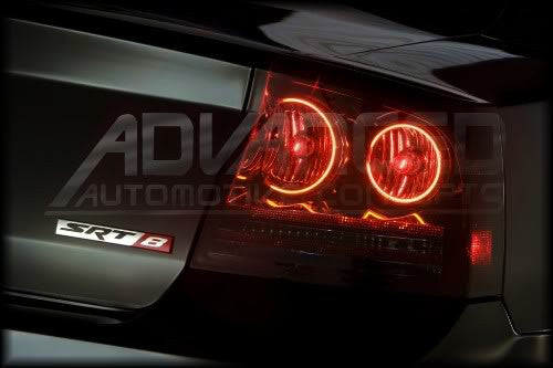 Close-up on a Dodge Charger tail light with LED halo rings installed.