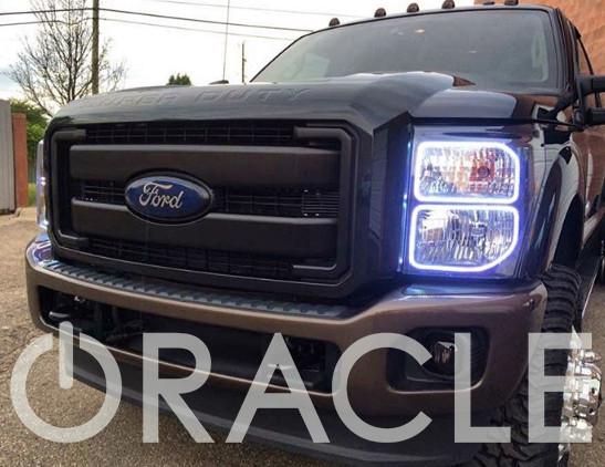 Front end of a Ford Mustang with white LED headlight halo rings installed.
