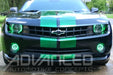 Front view of black camaro with green accents and green halo headlights