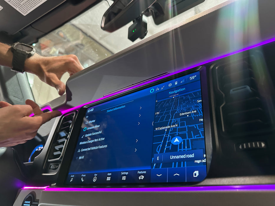 Close-up on the console of a Ford Bronco, with purple fiber optic lighting installed.