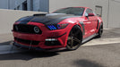Red mustang outdoors with rainbow halos and DRL