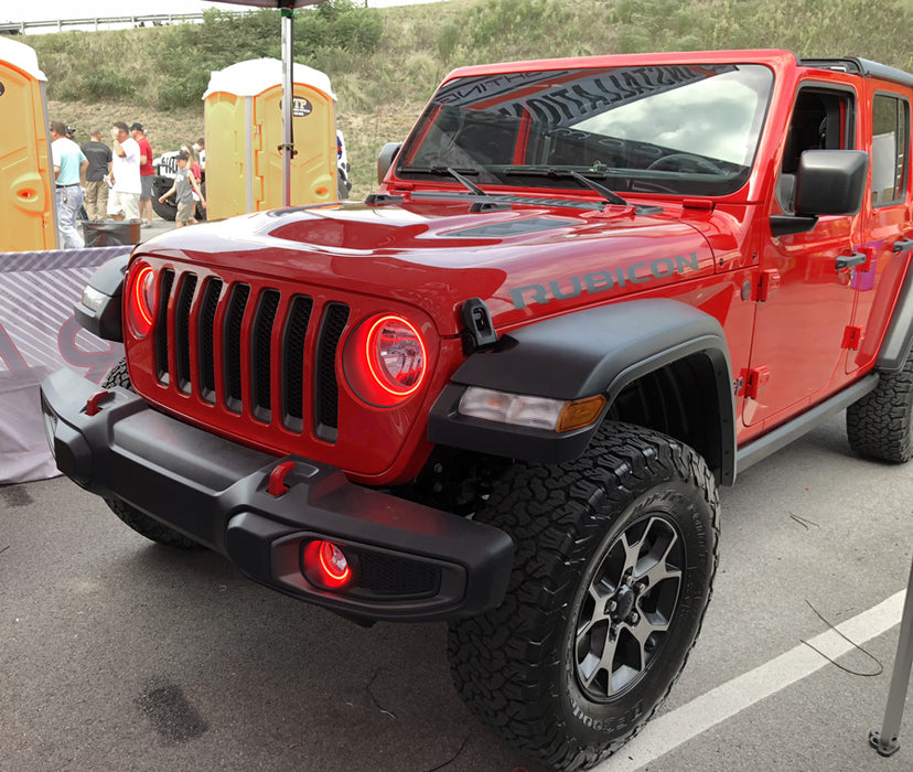 Red jeep in parking lot with bright red halos