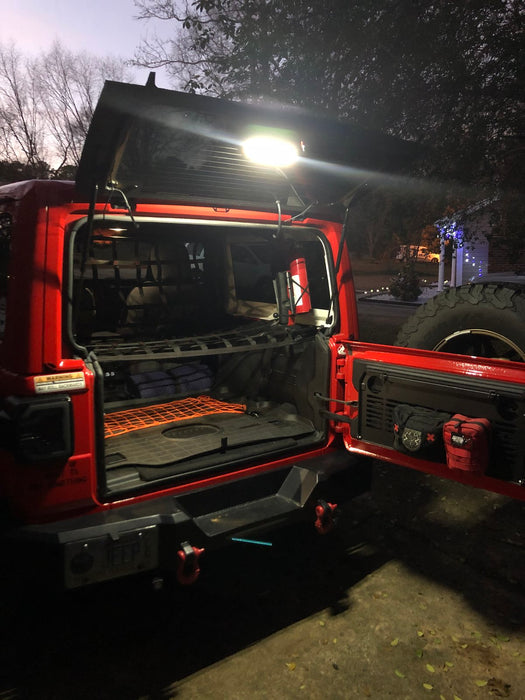 Red jeep with white LED cargo light