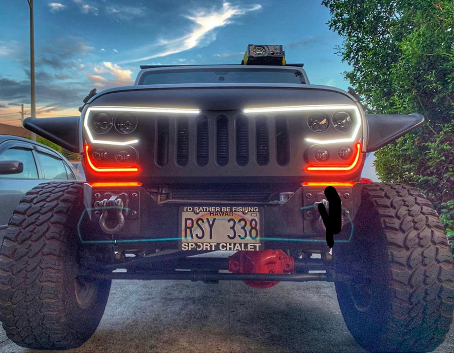 Close-up of vector grill installed on jeep outdoors
