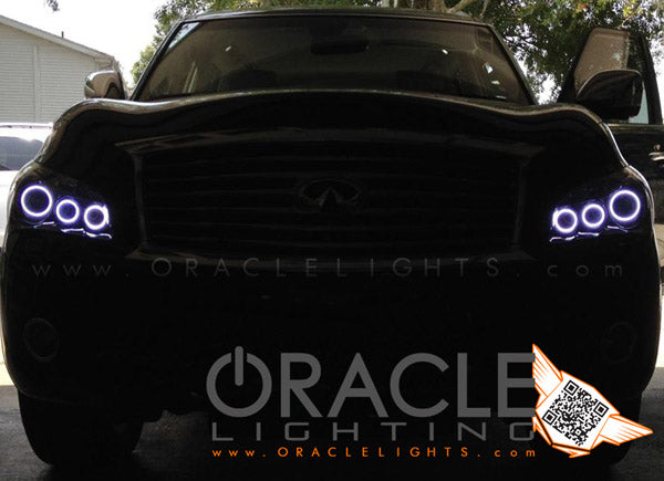 Front end of an Infiniti QX56 with white LED headlight halo rings installed.