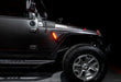 Side view of a Jeep Wrangler JK with the Sidetrack™ LED Fender Lighting System installed, set to amber LEDs.