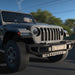 Rendering of a Jeep driving down the road, equipped with Oculus Headlights and LED Integrated Skid Plate.