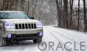 Jeep Grand Cherokee with white LED headlight and fog light halos installed.