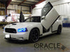 White charger in garage with butterfly doors and blue halo headlights