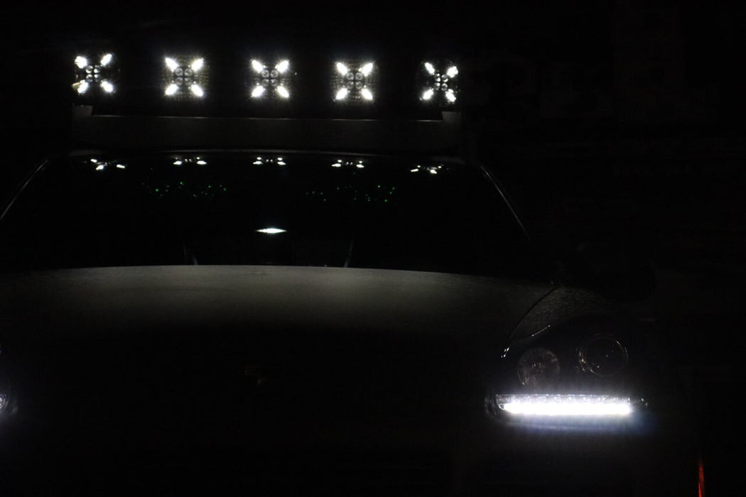 Front view of a Porsche with 5 Multifunction LED Spotlights installed on the roof.