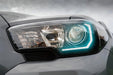 Close-up of a Toyota Tacoma headlight with white DRL.