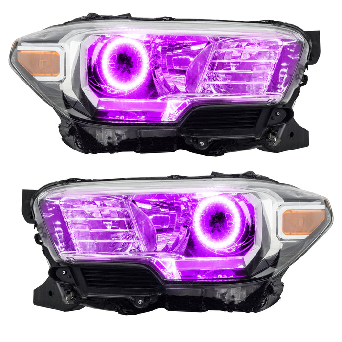 Toyota Tacoma headlights with pink LED halo rings.